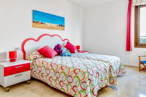 Colourful guest bedroom with bathroom en suite