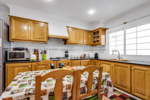 Kitchen with further dining area