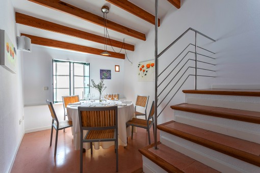 Dining area with wooden ceiling beams