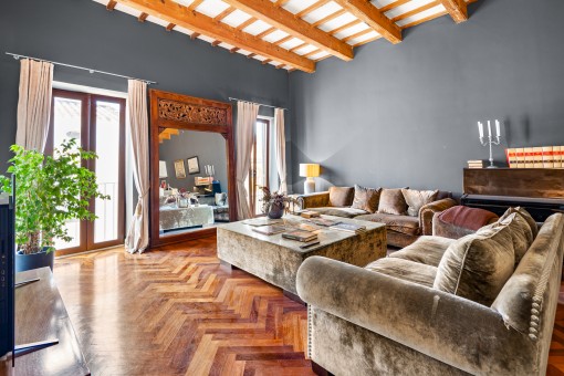 Comfortable living area with wooden ceilings beams