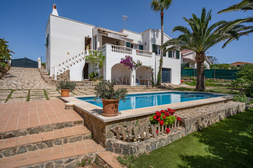 View of the villa with pool and garden